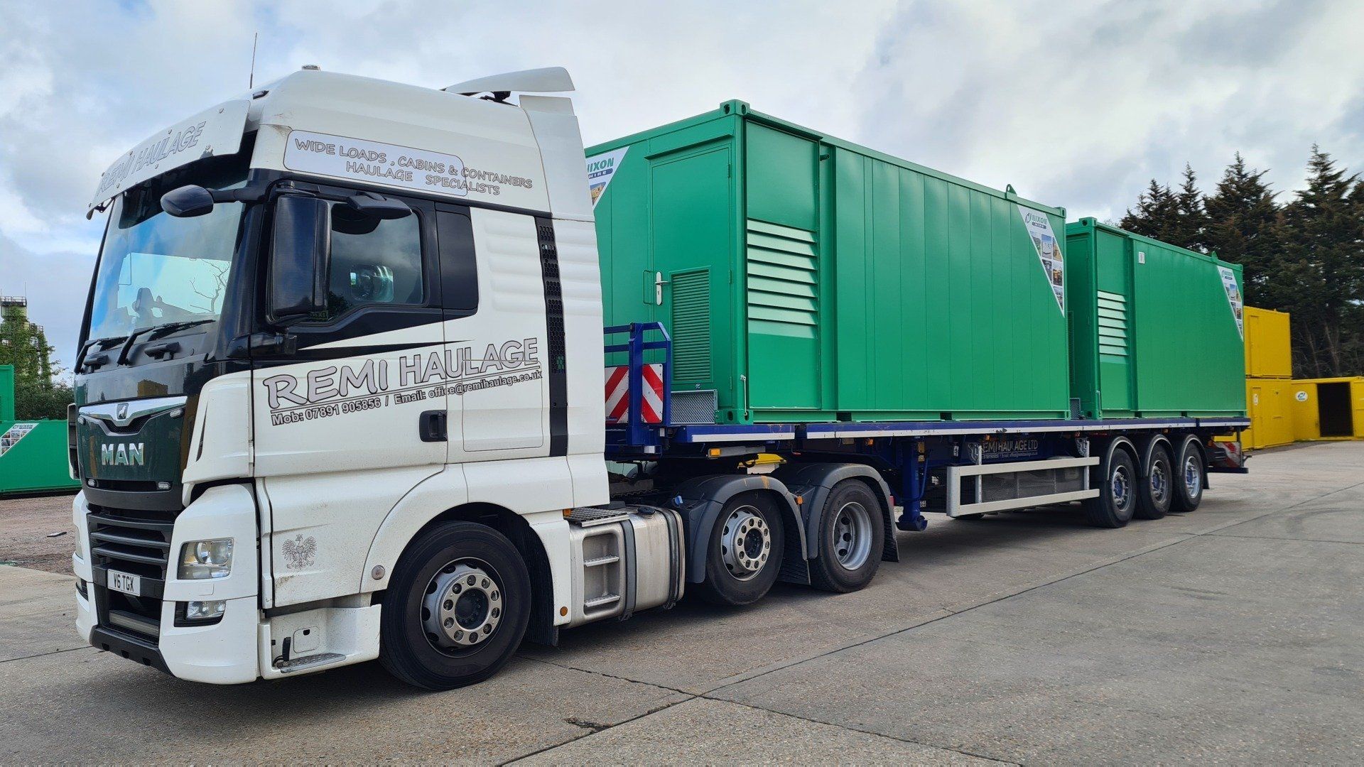 Remi Haulage truck carrying a large transport container