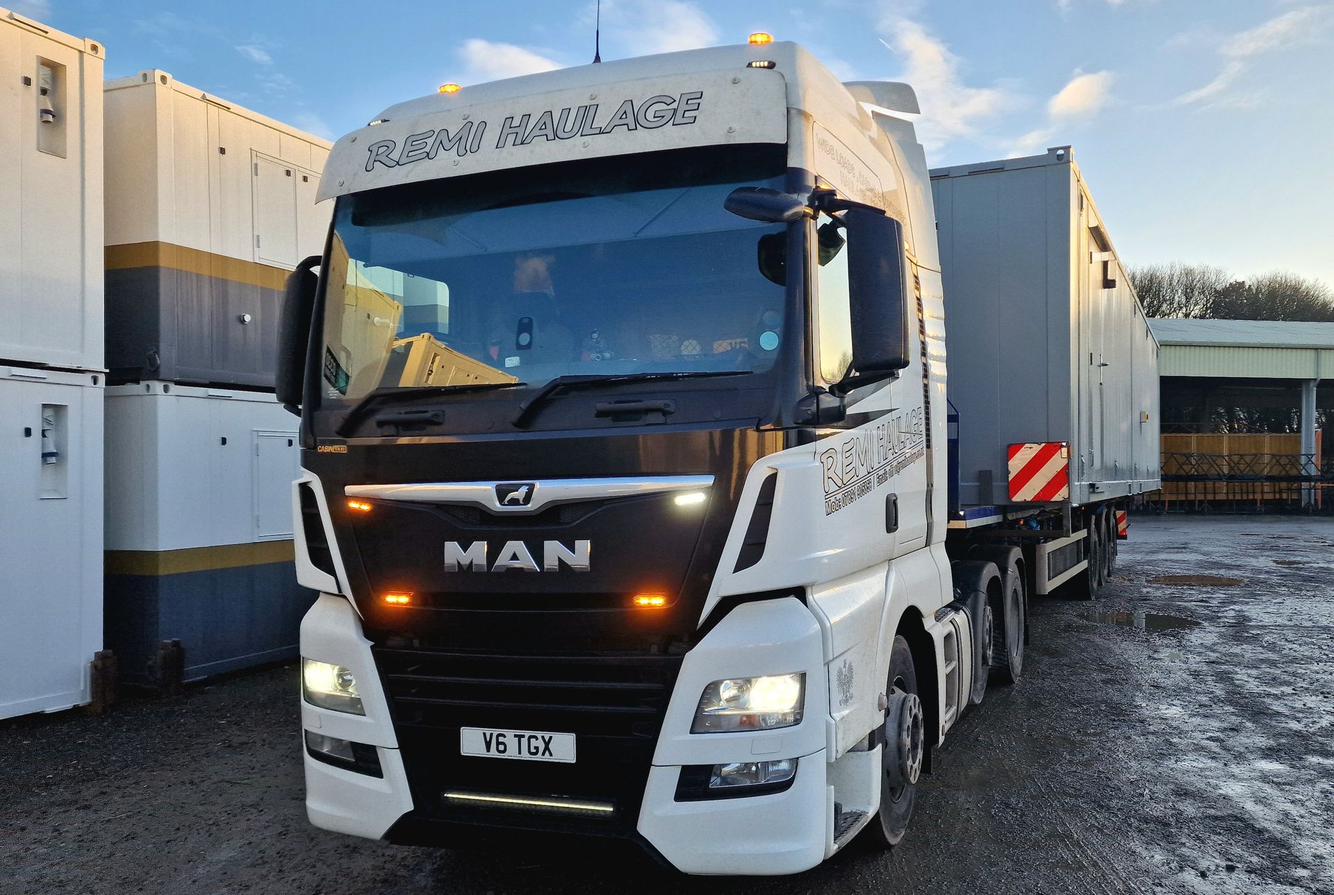 Remi Haulage truck collecting a modular cabin
